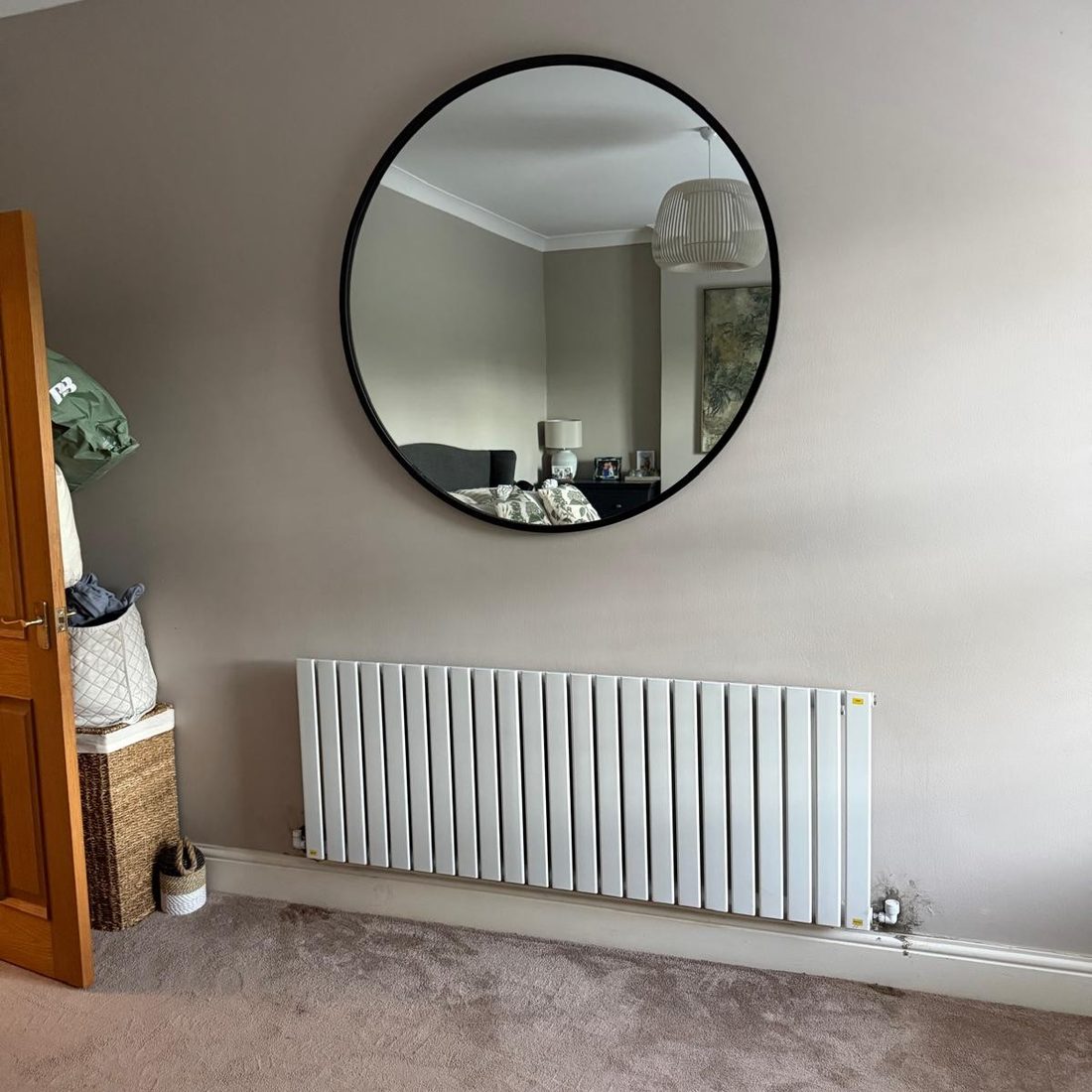 New panel radiator fitted in a living room